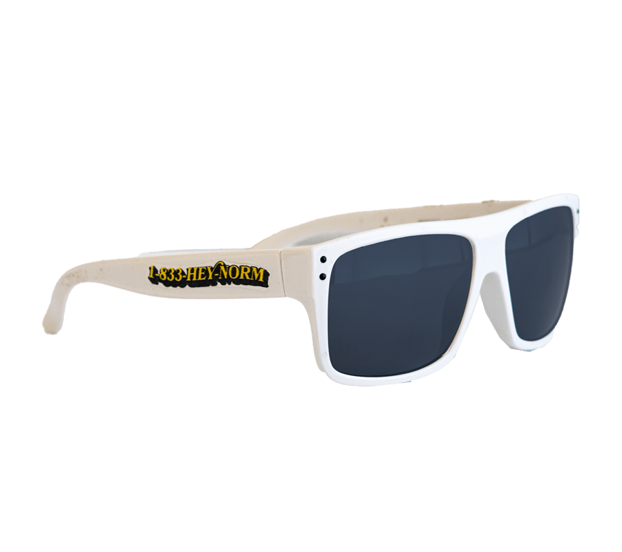 White plastic sunglasses with '1-833-HEY-NORM' inscribed on the temple